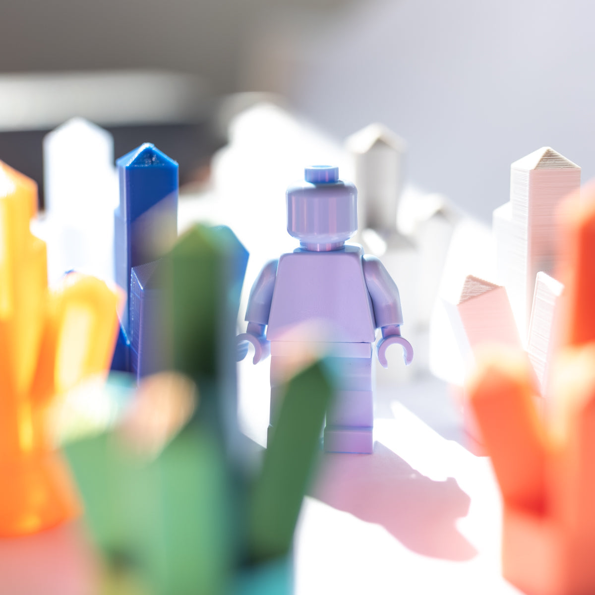 Minifigure standing among colorful 3D-printed crystal clusters