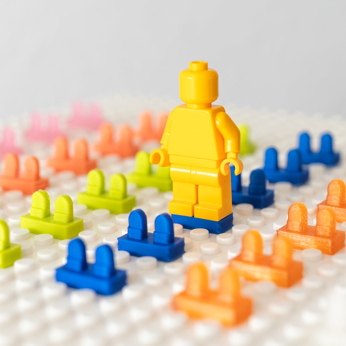 Minifigure displayed with colorful 3D-printed heel savers