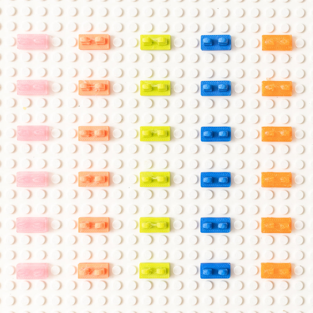 Underside view of 3D-printed heel savers in five colors